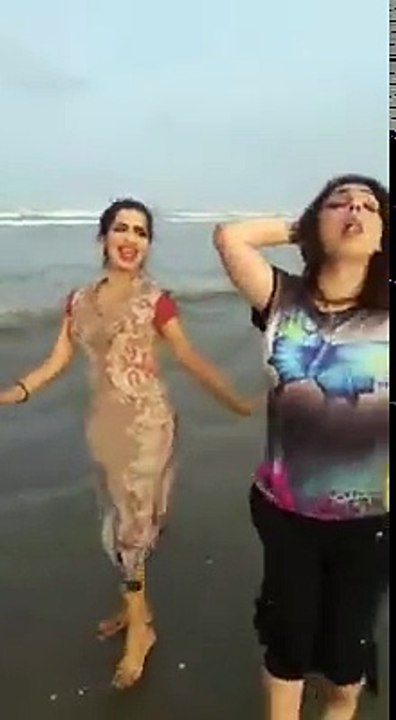 2big booty girls dancing on beach