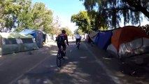 Biker Rides Past Homeless Encampments on Bike Trail