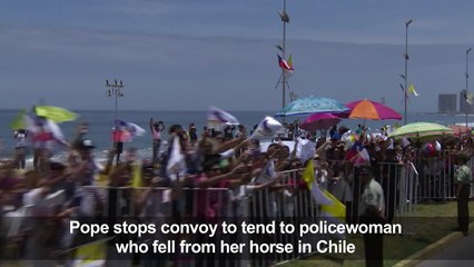 Pope tends to fallen policewoman in Chile