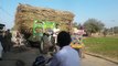 tractor driving stunt and heavy loaded trolly tractor on road