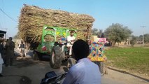 tractor driving stunt and heavy loaded trolly tractor on road