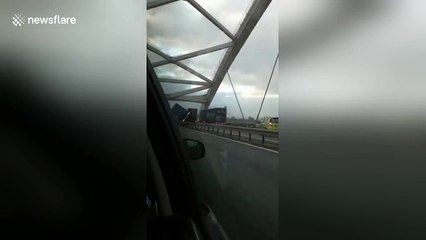 Truck blown over by extreme crosswinds in The Netherlands