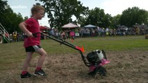 Competitors race motor-powered garden tillers in bizarre race