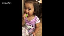 Adorable 2-year-old girl thinks licking a lime is the funniest thing ever