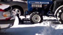 1980 Ford 1200 tractor plowing snow