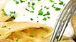 Homemade Pierogi are stuffed with a flavorful potato and cheese mixture, boiled, and fried up in melted butter for a delicious, indulgent, total comfort food di
