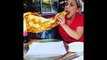 Woman Takes On Massive Slice Of Pizza - Woman Eating A Giant Slice Of Pizza