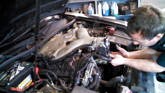 Spark plug replacement Cadillac CTS 3.6L 2007 ignition coil install remove replace how to change