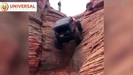 شاهد رجل يتحدى الجاذبية ويسير بسيارته الجيب رأسيا على قمة جبل