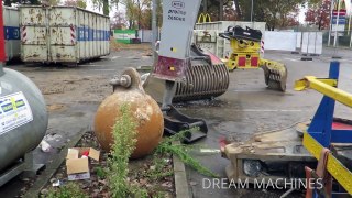 CATERPILLAR 324E EXCAVATOR WITH WRECKING BALL DESTROYING CONCRETE