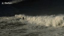 Surfer rides monster wave off Nazare