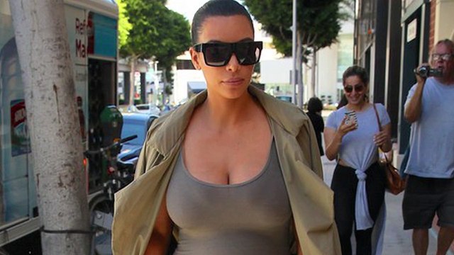 Pregnant Kim Kardashian Flashes Her Bare Baby Bump