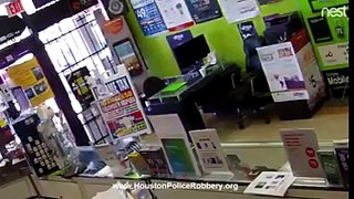 This video shows a man trying to rob a Houston cell phone store
