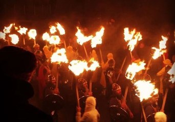 Viking Marchers Carry Torches and Replica Longboat at Fire Festival