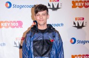 Louis Tomlinson discusses watching One Direction bandmates perform