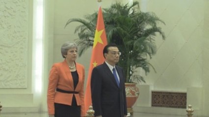 May apoya la expansión global de China a cambio de mayores lazos comerciales