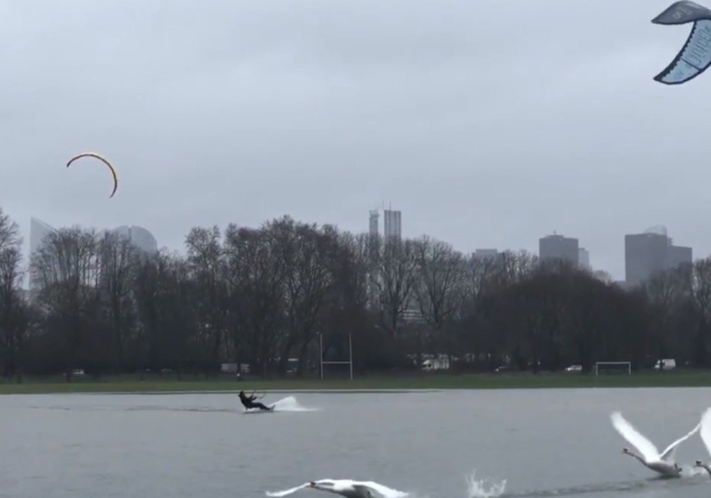 Kite Surfers Have Fun on Flooded Football Pitch in Paris Park
