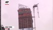 Raw: Crane Dangles From NYC High-rise