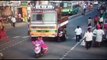 Two girls on scooter escape after falling under lorry