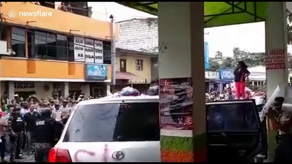 Ecuador’s Correa attacked by protesters on campaign trail