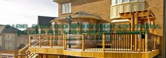2 level cedar deck with wrought iron railings, pergola and stone walkout basemen