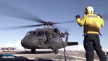 Amazing military helicopter landing on ship deck in rough seas