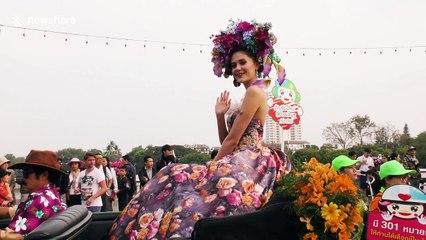 Beauty queens in classic cars drive through Chiang Mai, Thailand