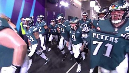 Lane Johnson carries Jason Peters' jersey out as Eagles take the field