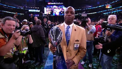 Philadelphia Eagles kiss the Lombardi Trophy on its way up to the stage