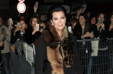 Kris Jenner faceplants into coffee table