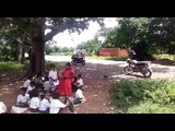 Education giving to students under tree