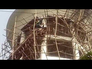 NSUI candidate climbs up on water tank in Agra of UP