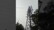 youth climbs in tower in delhi, traffic jam