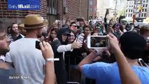 Justin Bieber taking pics with fans at Z100 radio station in NYC (August 24)