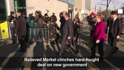 Relieved Merkel clinches hard-fought deal on new government