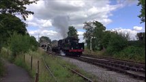 Tender Engine pulling a Train of Coaches out of the Station on British Steam Railway