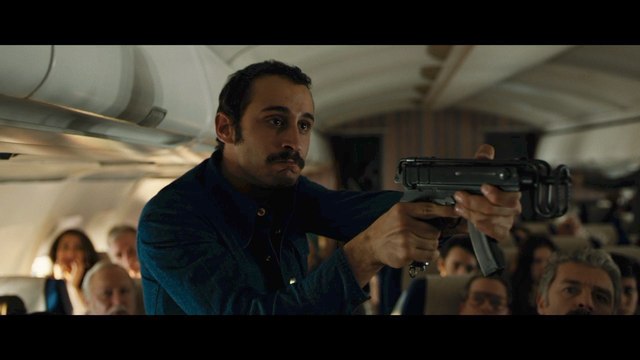 Daniel Bruhl, Rosamund Pike Hijack A Plane In '7 Days in Entebbe' Clip