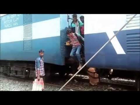 dangerous video children cross railway track under train