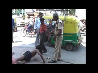 mentally disturbed man fragged by agra police in publicly