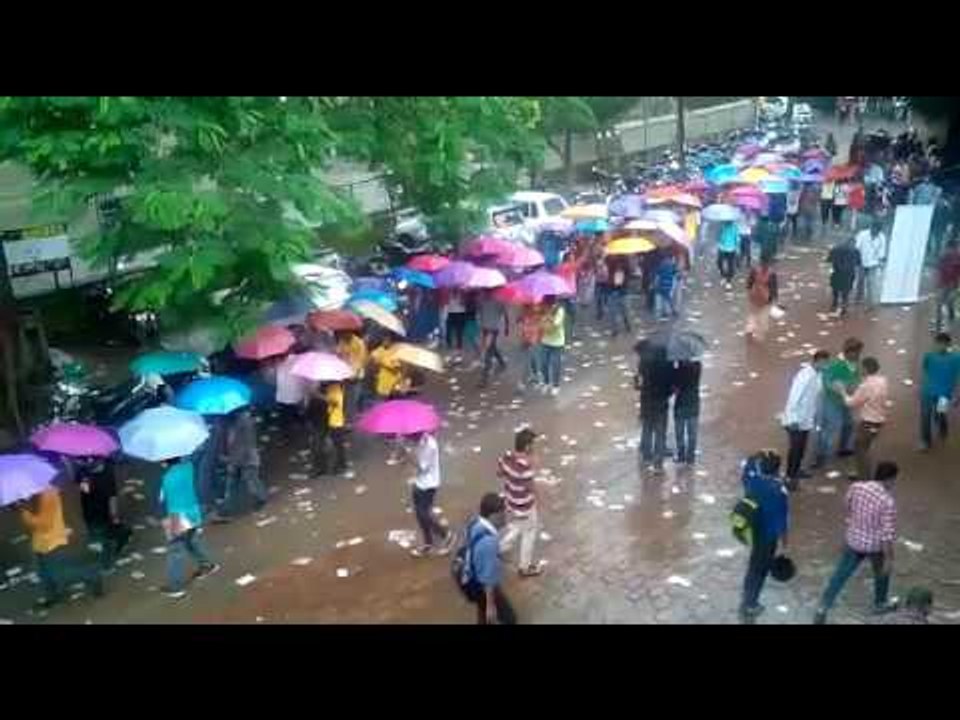 students march with umbrella