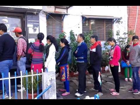 Take note of the people in the bank and the ATM queue