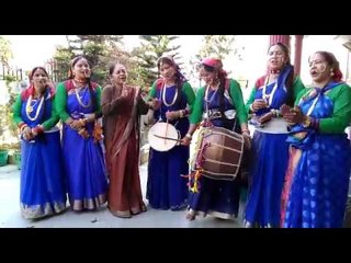 Women hold drum and dhol after sung a cultural song