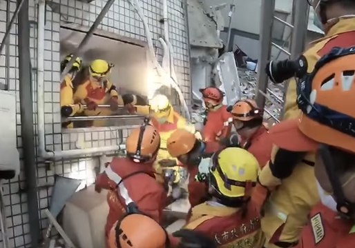 Search and Rescue Team Evacuates Leaning Building as Earthquake Aftershocks Felt