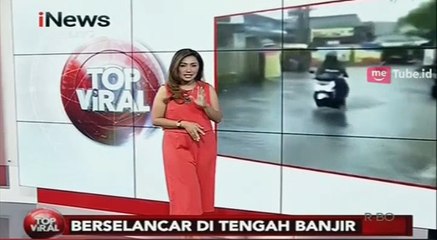 Download Video: Aksi Pria Berselancar di Tengah Banjir Ini Jadi Viral