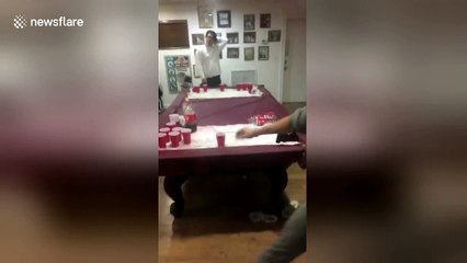 Man nails 360-degree slam dunk at beer pong