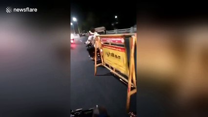 Chennai biker gang drag traffic barricade along road