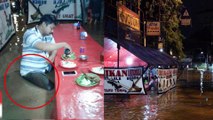 Foto viral pria makan di tengah-tengah banjir - TomoNews