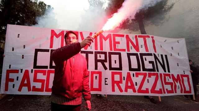 Italians march against racism after shooting spree