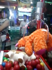 Almost winning big plush claw machine