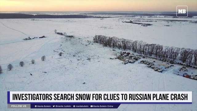 Investigators search snow for clues to Russian plane crash